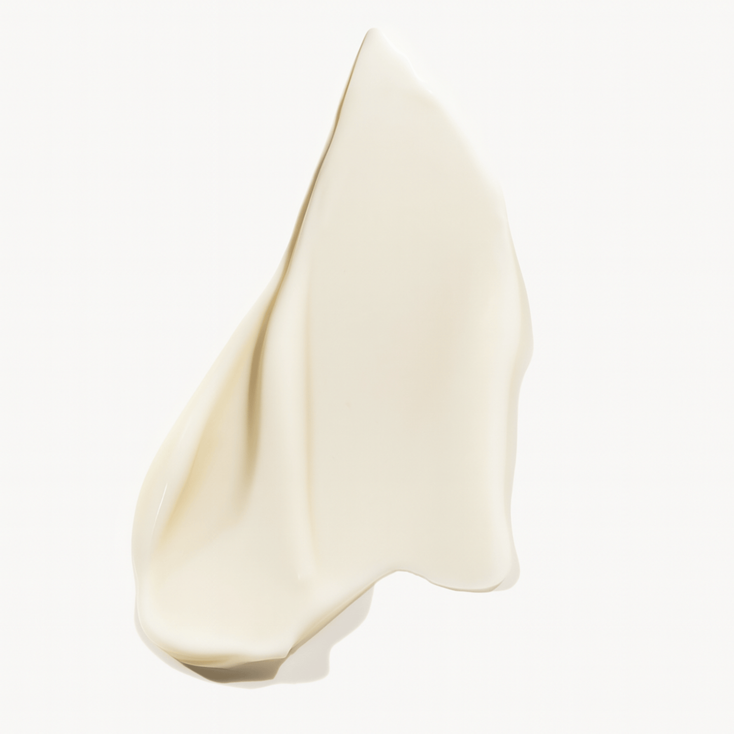 Creamy product texture on white background.