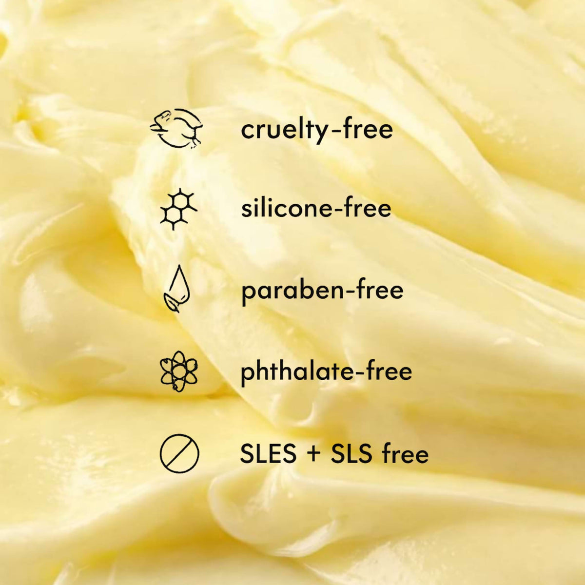 Close-up of a creamy texture Deep Conditioner with 'cruelty-free', 'silicone-free', 'paraben-free', 'phthalate-free', and 'SLES + SLS free' labels.
