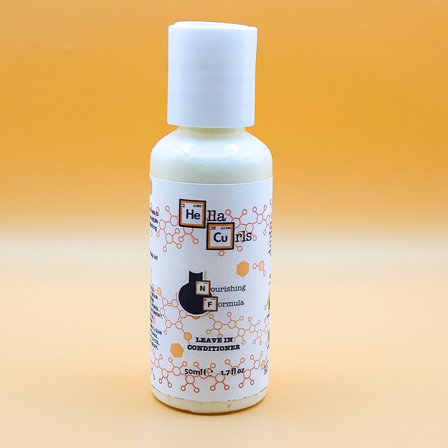 Bottle of Hella Curls leave-in conditioner on a gradient orange background