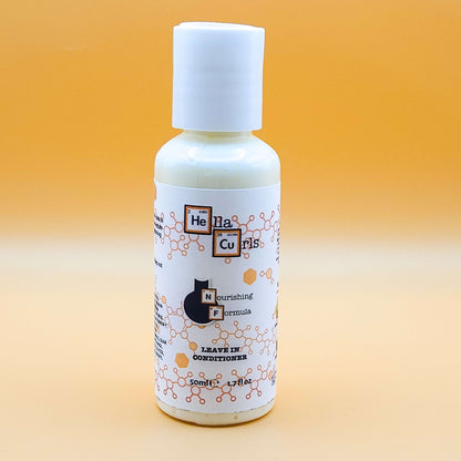 Bottle of Hella Curls leave-in conditioner on a gradient orange background