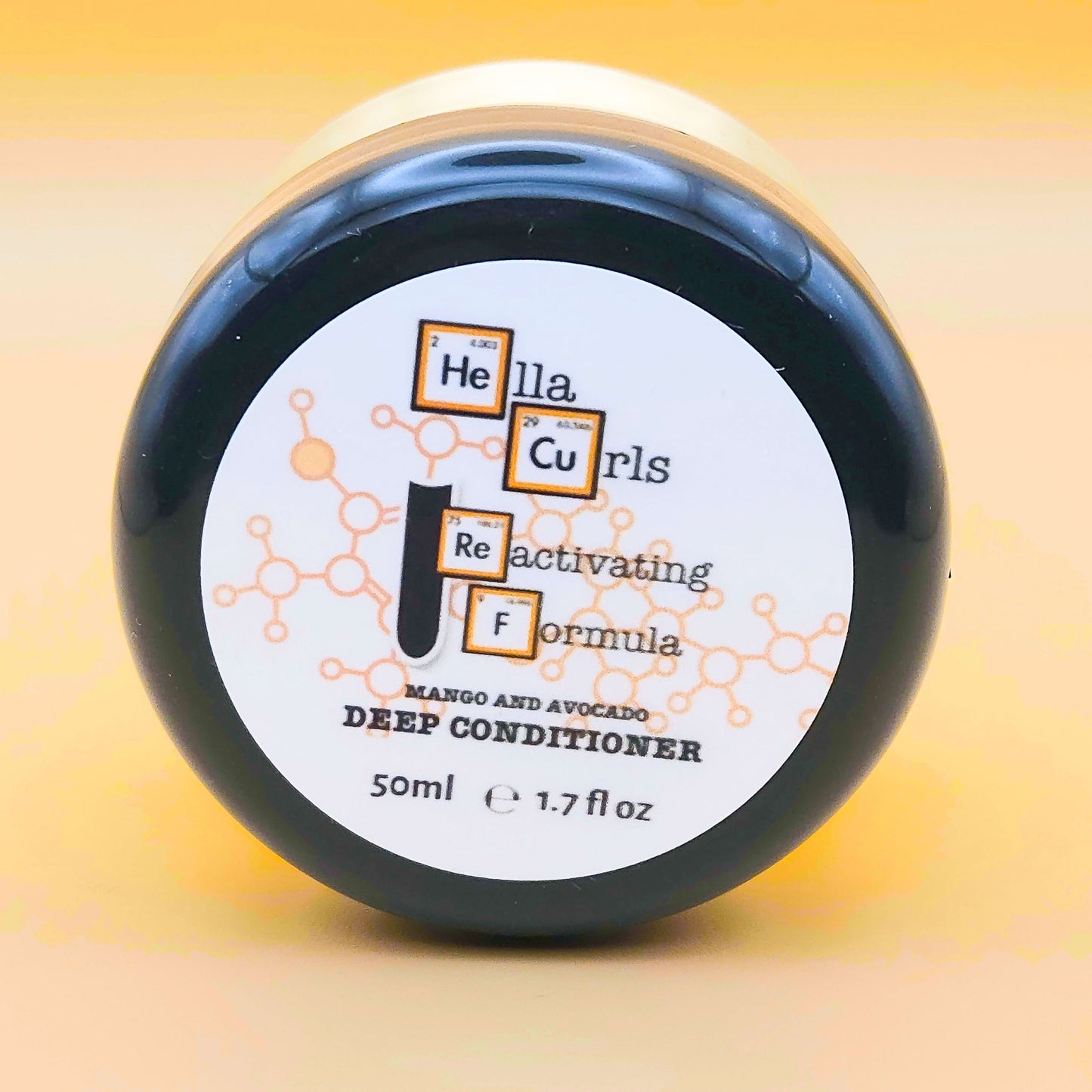 Jar of Hella Curls Reactivating Formula Deep Conditioner on a yellow background