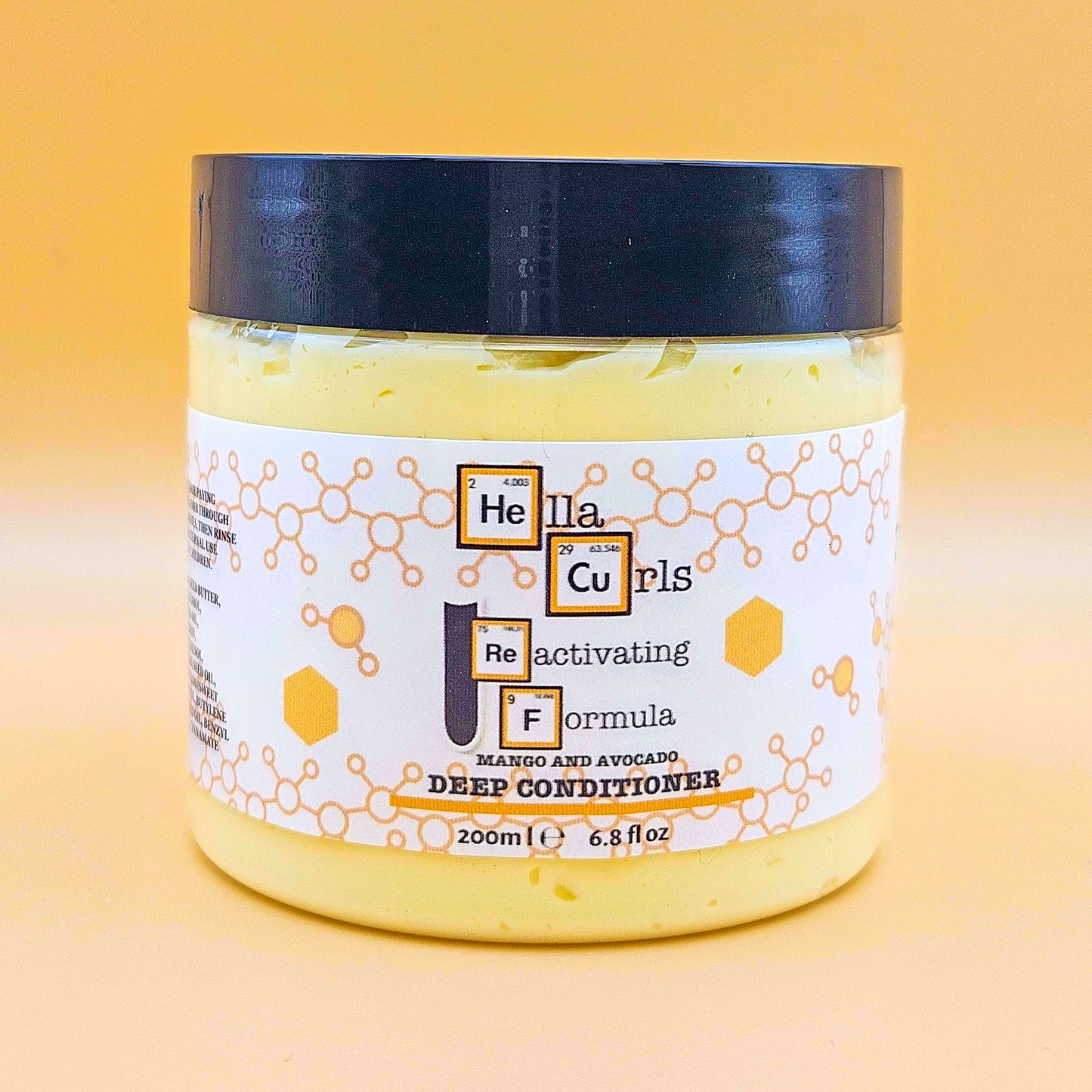 Jar of Hella Curls Reactivating Formula deep conditioner with a yellow background