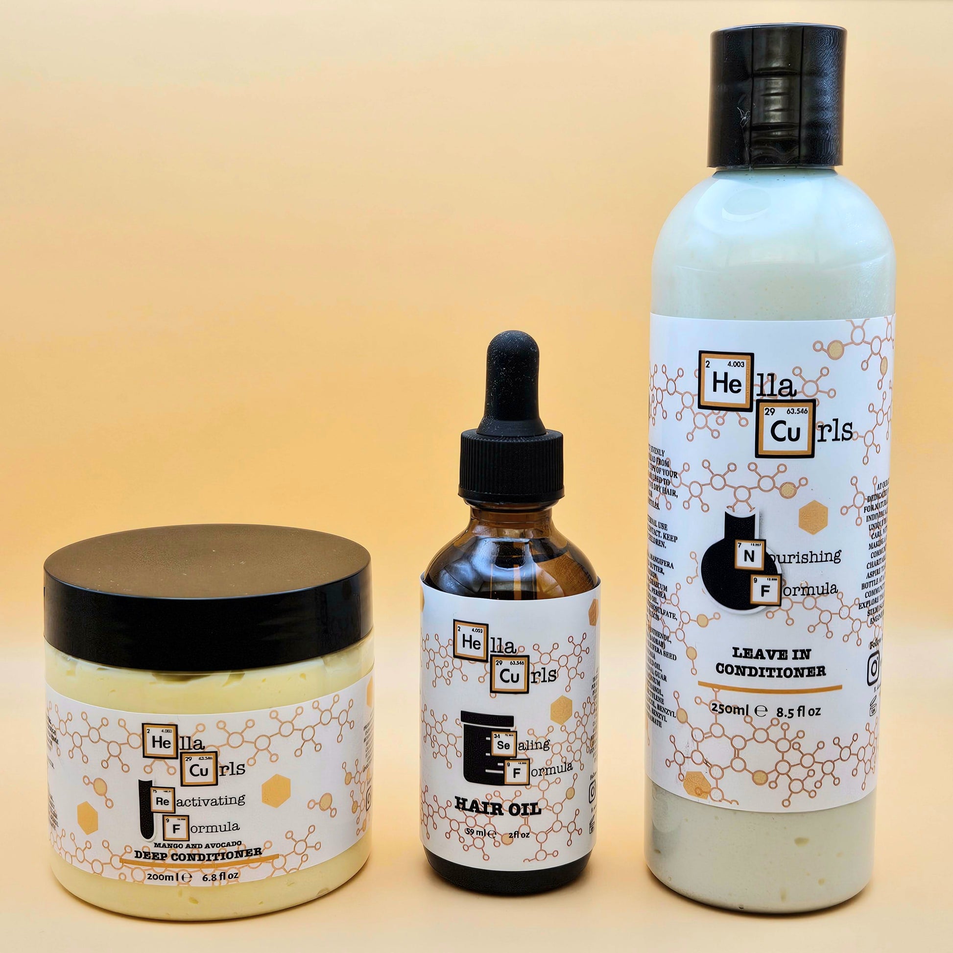 Three hair care products from Hella Curls on a beige background